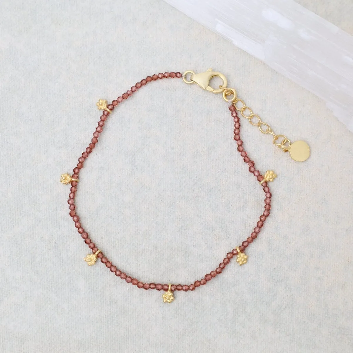 Faceted Garnets with Gold Charms Bracelet